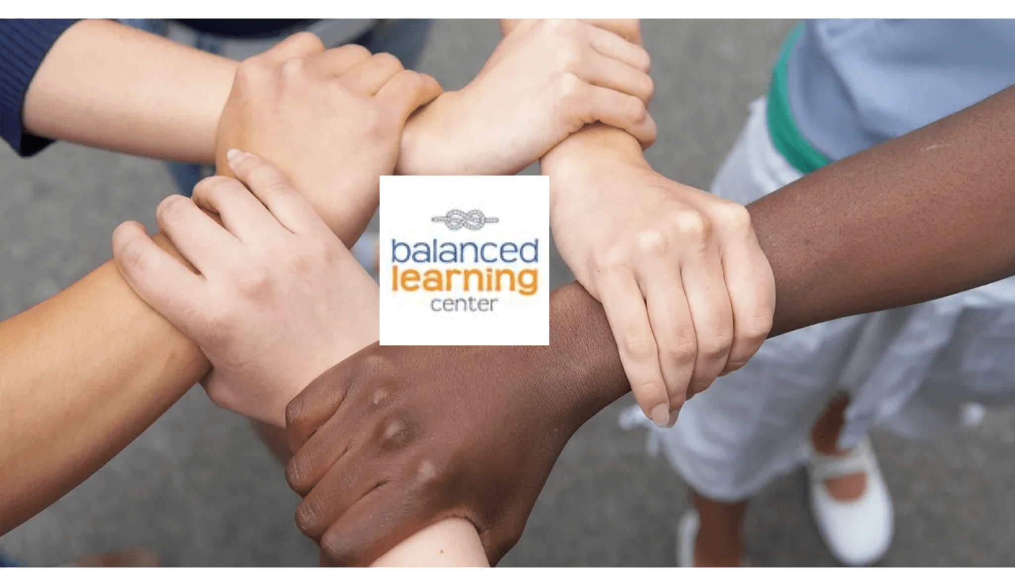 Diverse hands joined together forming a united circle around a logo.