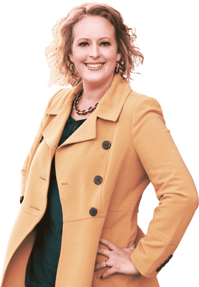 A woman in a mustard yellow coat smiling.