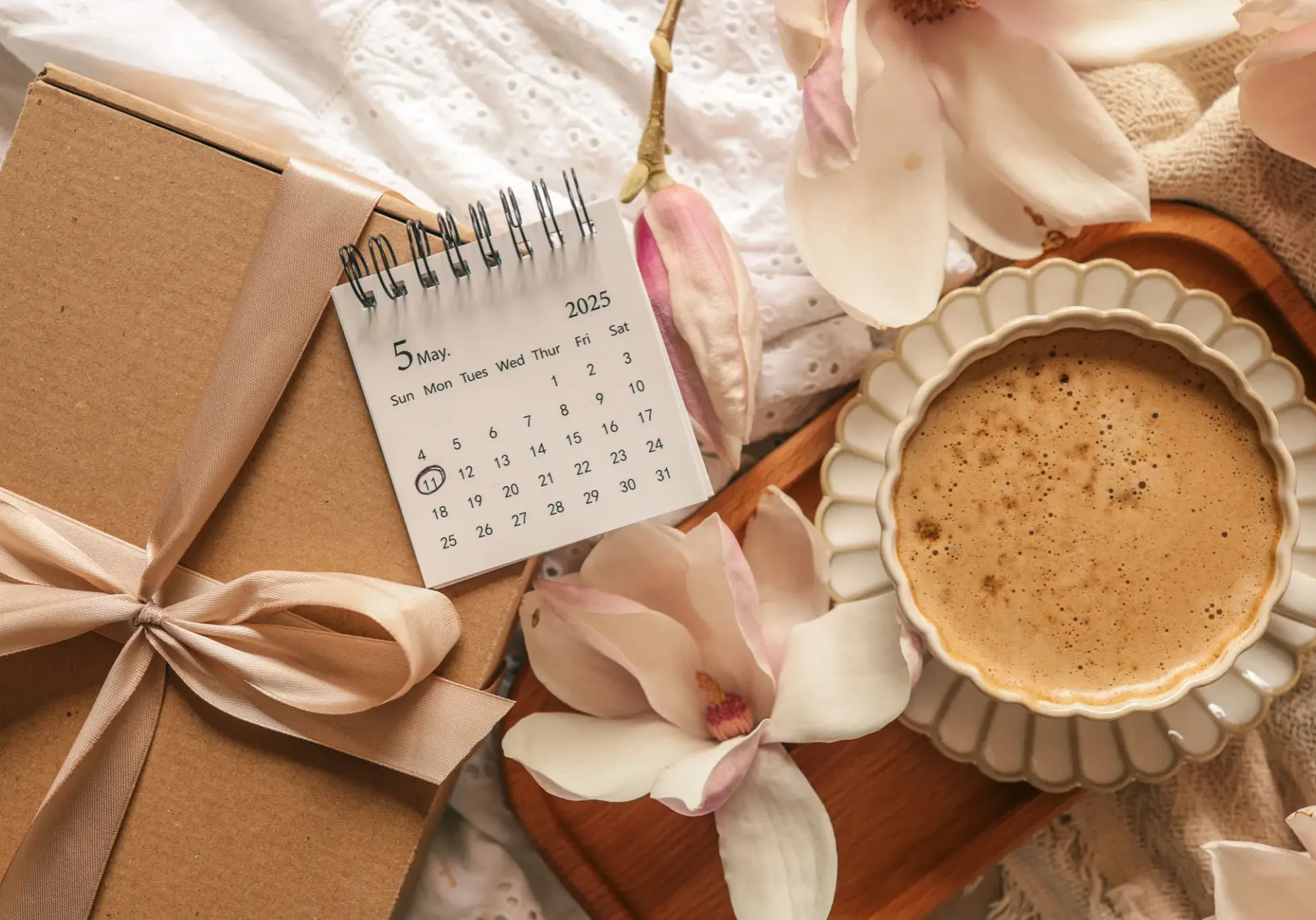 A cozy scene with a calendar, flowers, and a pie.